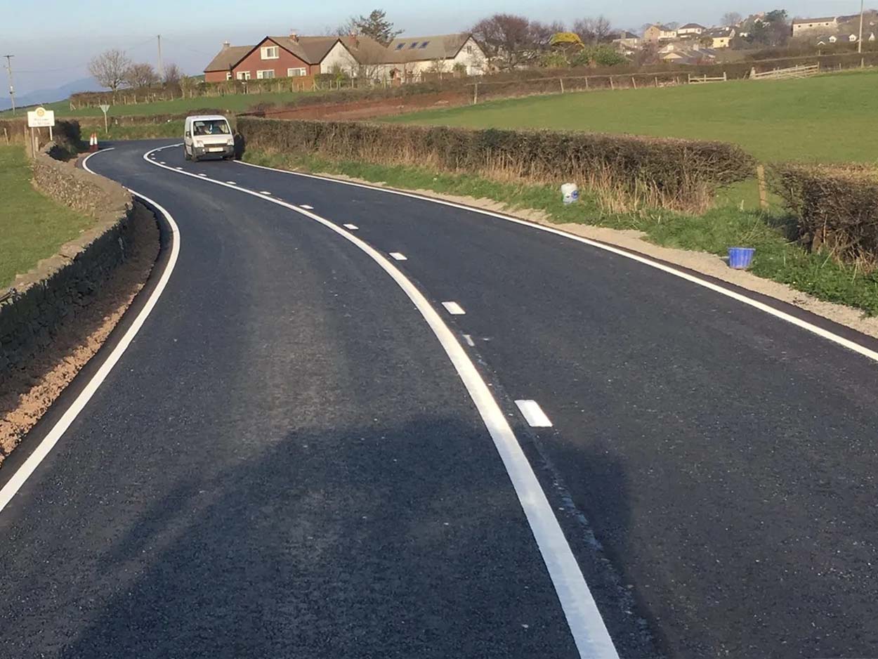 White road markings on a country road